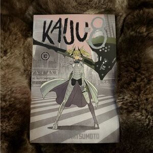 KAJU No. 8 Manga Volume 10 — Pink, Green & Gray Cover